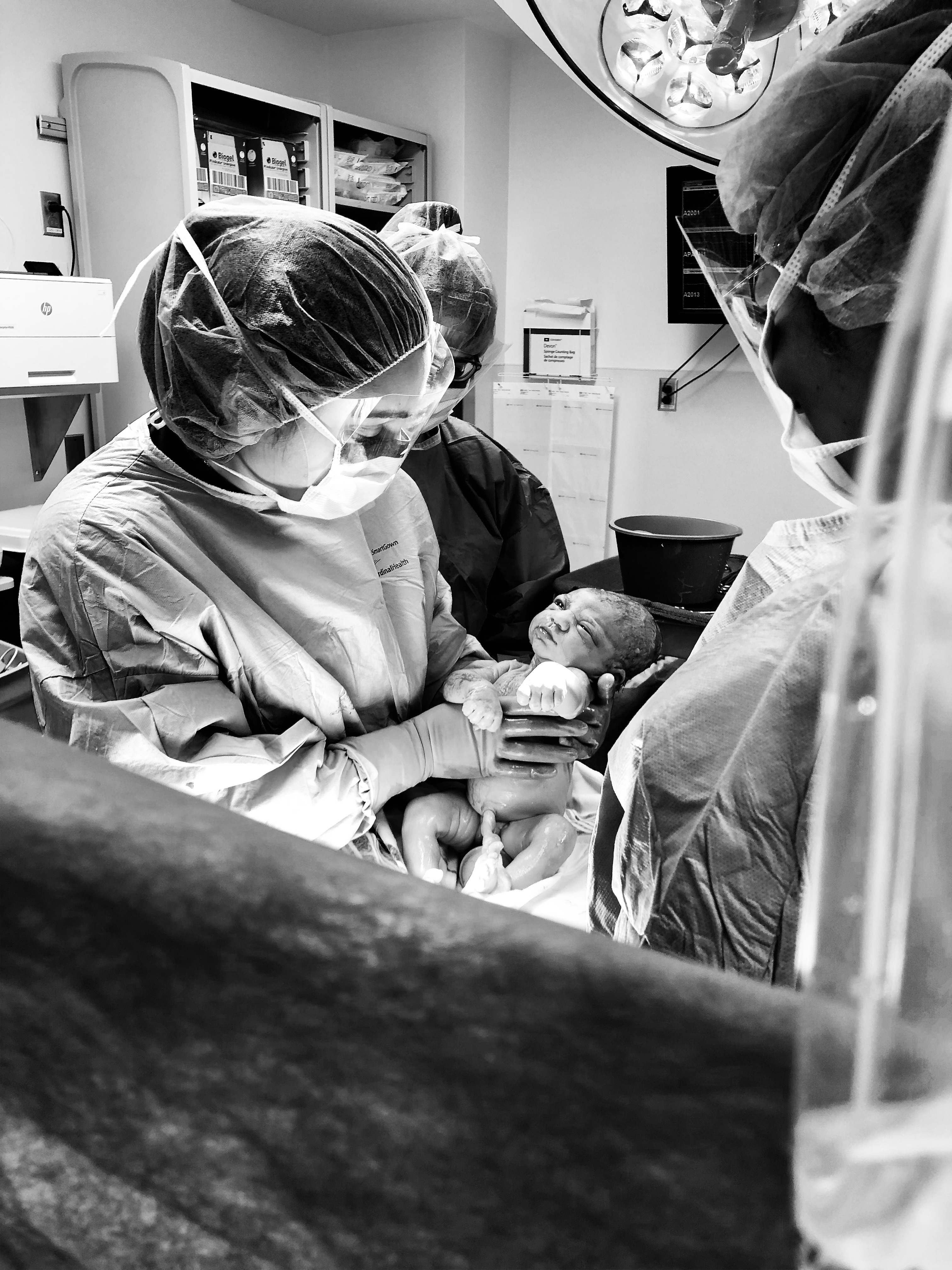 Dr. Shweta Patel delivering a baby in the operating room
